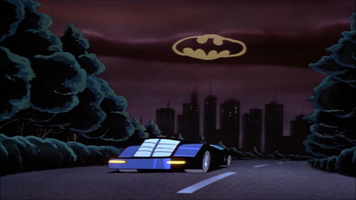 バットマンのバットシグナルの下にあるバットモービル：幻想の仮面