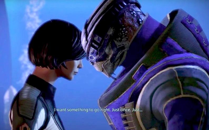Shepard è Garrus inclinati vicinu à parlà in Mass Effect 2.