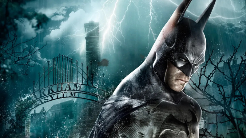   Batman stojí v dešti před branami Arkham Asylum