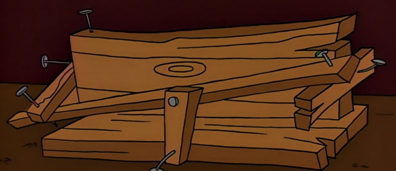  Homer's spice rack from the Simpsons. A misshapen, lopsided wooden rack with nails sticking out of it.